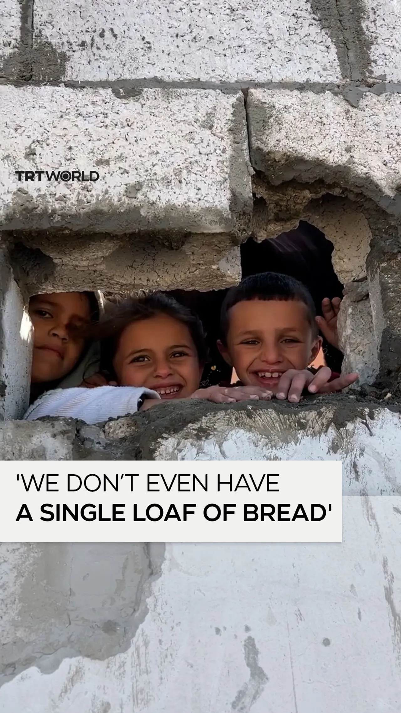 Palestinian children plead for flour at empty UNRWA warehouse